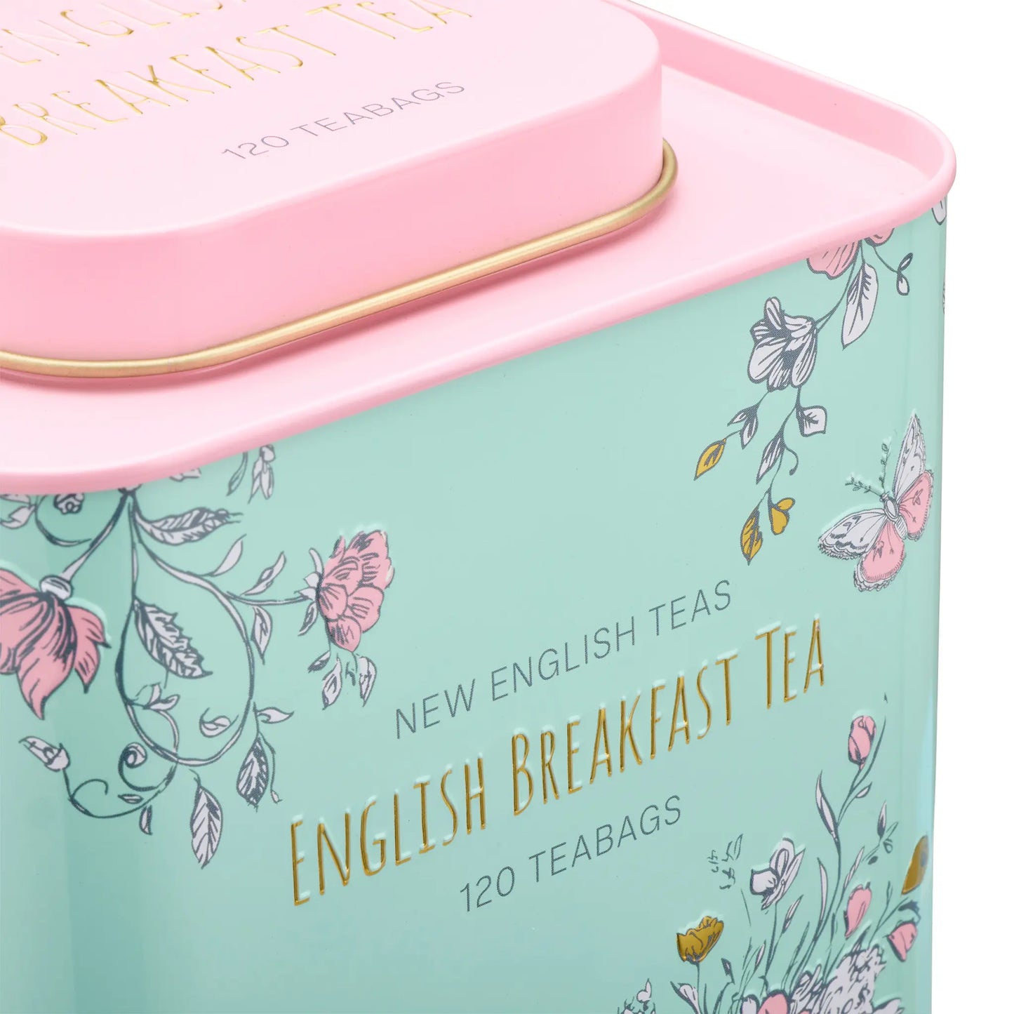 Tea tin with floral design and 'English Breakfast Tea' text on a light blue background