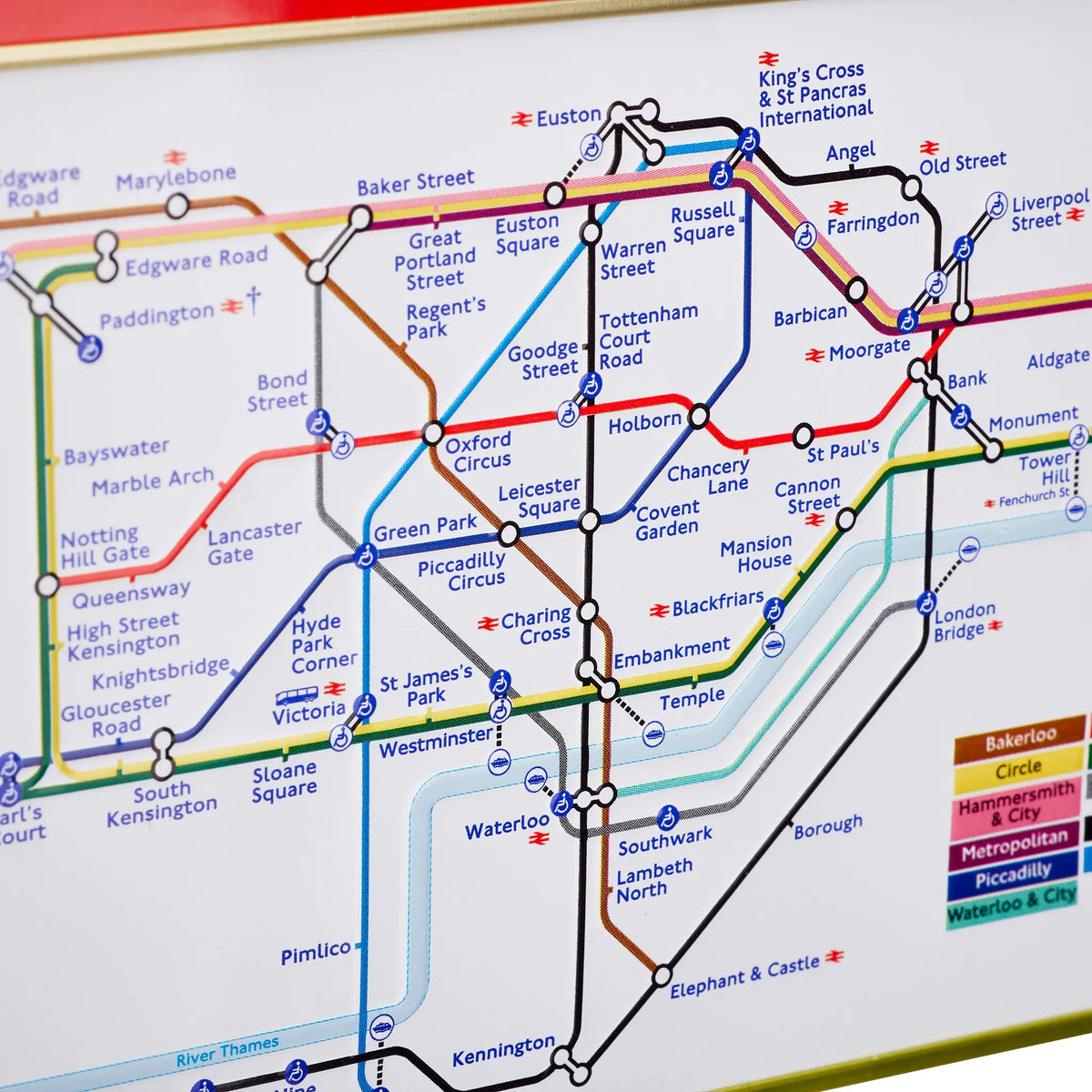 A close-up of a London Underground map showing multiple colored transit lines, station names, and a legend in the bottom right corner.