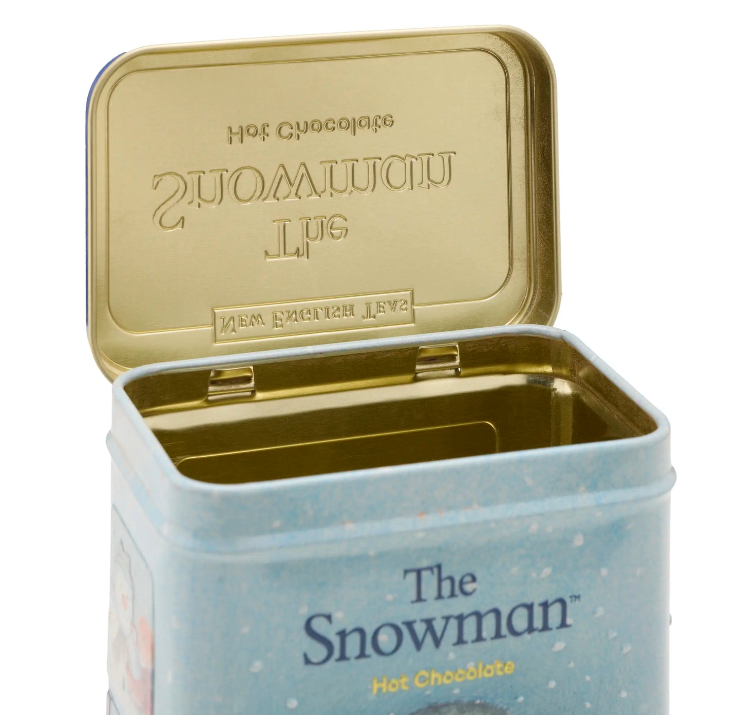 Open tin of 'The Snowman' hot chocolate with gold lid on a white background
