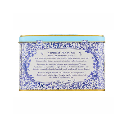 A square metal tin of Beatrix Potters 160th Anniversary English Breakfast Tea, featuring a blue and white floral pattern with a light blue top band and gold-toned rims.