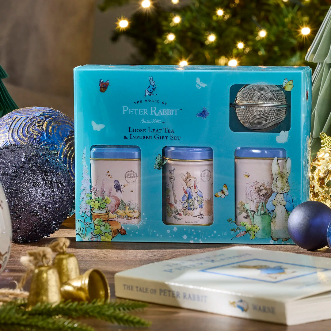 Peter Rabbit tea & infuser gift set with Christmas decorations in the background