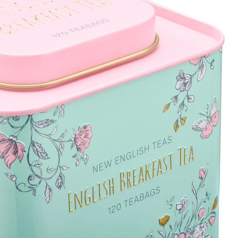 Tea tin with floral design and 'English Breakfast Tea' text on a light blue background