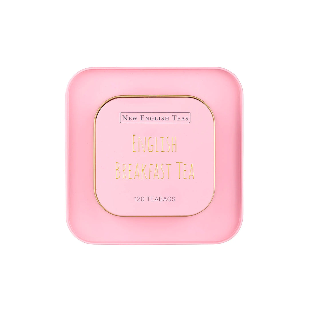 Pink tin lid of New English Teas English Breakfast Tea on a white background