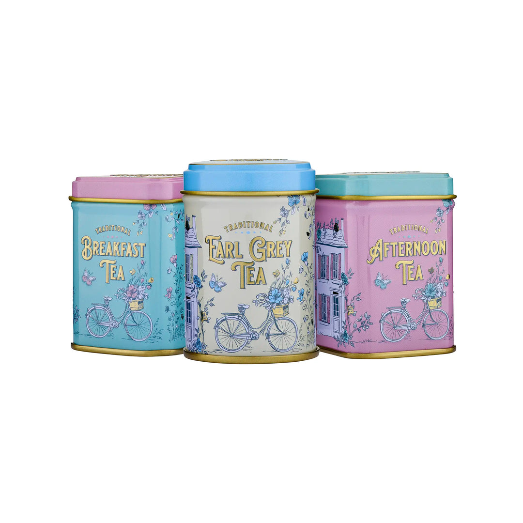 Three decorative metal tea tins with pastel colors and bicycle illustrations, labeled Breakfast Tea, Earl Grey Tea, and Afternoon Tea, on a white background.