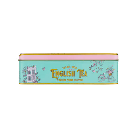 A rectangular metal tin of traditional English tea with a pastel mint green body, pink lid, and gold lettering, decorated with illustrations of a house, bicycle, and flowers.