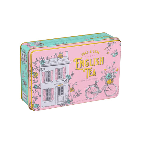 A rectangular metal tin of English Tea Selections, decorated with a pink house, bicycle, and floral motifs on a light pink background.