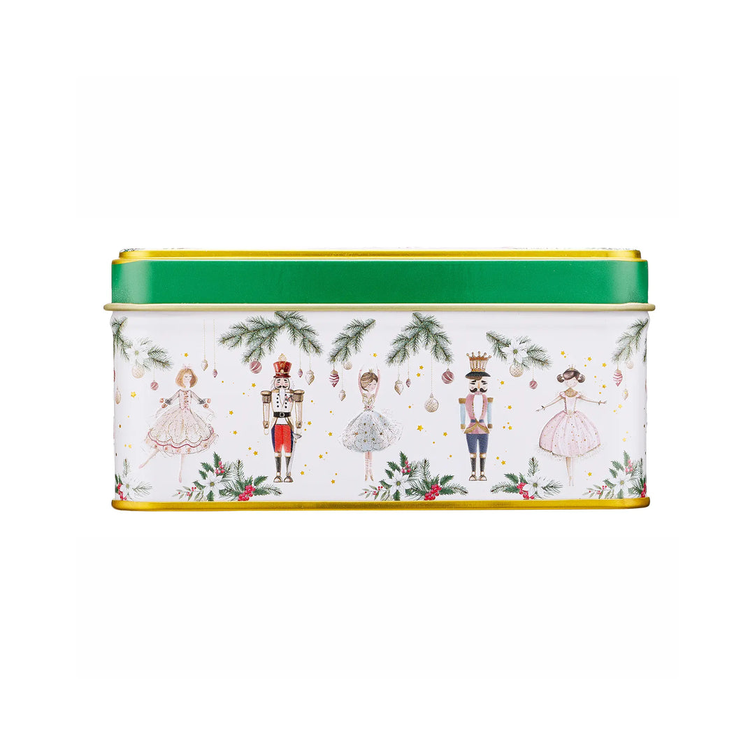 A rectangular metal tin with a white body decorated with Christmas nutcracker illustrations, green pine branches, and red berries, featuring a bright green lid with gold trim.