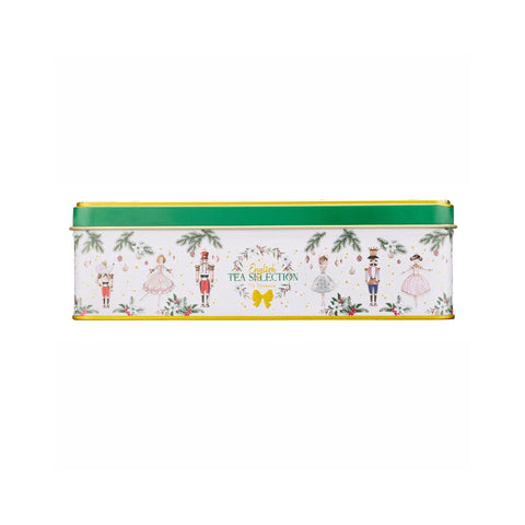 A rectangular metal tea tin with a white body decorated with festive nutcracker and holiday illustrations, a green top rim, and gold lettering that reads 'Tea Selection'.