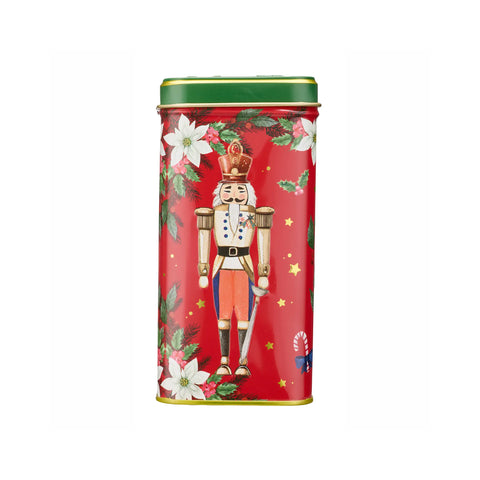 A rectangular red Christmas tin with a green lid and a festive nutcracker illustration on the front, set against a plain white background.