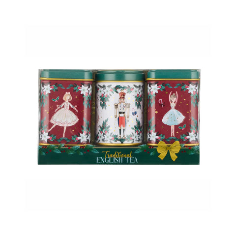 A boxed set of three traditional English tea tins with festive Christmas illustrations, including ballerinas and a nutcracker, on a plain white background.