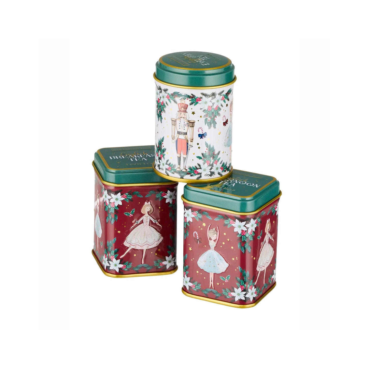 Three decorative metal tins with green lids and gold trim, arranged in a pyramid on a white background. The tins feature holiday illustrations: a nutcracker on a white tin, and ballerinas on two red tins.