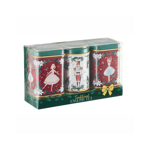 A boxed set of three traditional English tea tins with festive Christmas illustrations, including a nutcracker and ballerina designs, in red, green, and white packaging.
