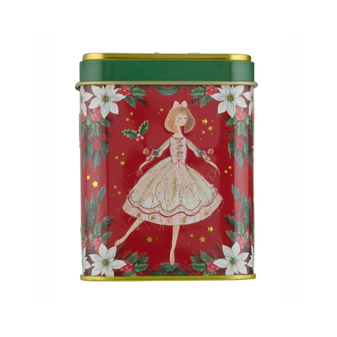 A rectangular metal tin with a festive Christmas design, featuring a red background with a central illustration of a dancing girl in a white dress, surrounded by white poinsettias, green holly leaves, and gold stars. The top lid is dark green with gold trim.