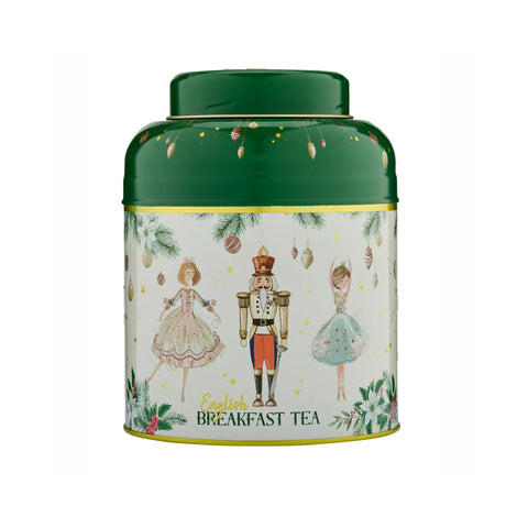 A cylindrical metal tea tin with a dark green lid and base, featuring a cream-colored illustrated label with Christmas-themed characters and the text 'English Breakfast TEA'.