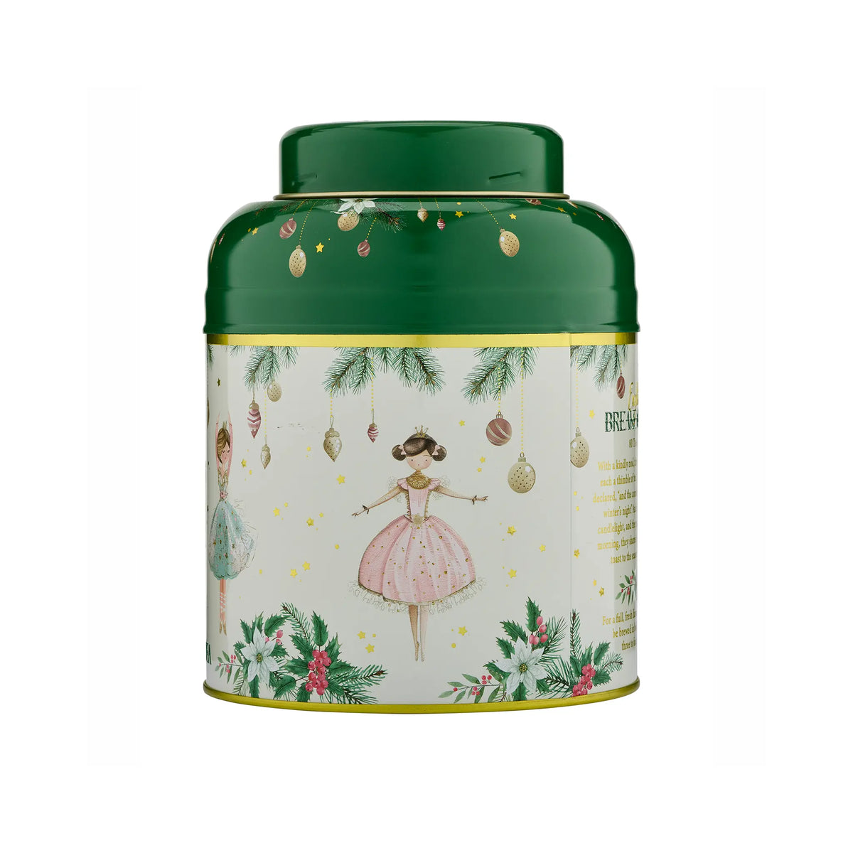 A round metal tea tin with a dark green lid and a cream-colored label decorated with Christmas illustrations, including a ballerina in a pink dress, hanging ornaments, pine branches, and festive greenery.