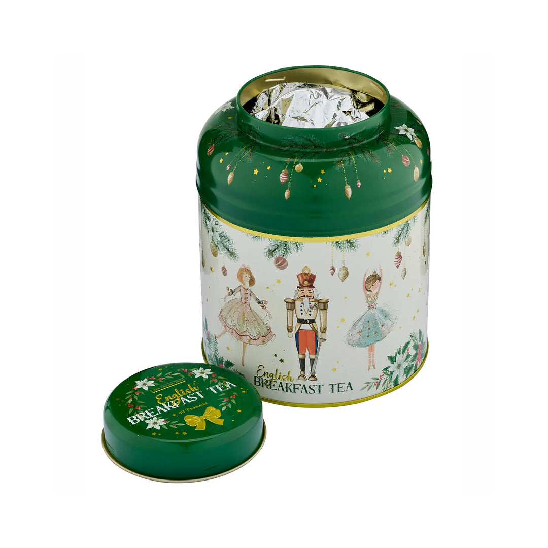 A green metal tea tin with a matching lid placed in front, shown on a white background. The tin is open, revealing silver foil-wrapped tea packets inside.