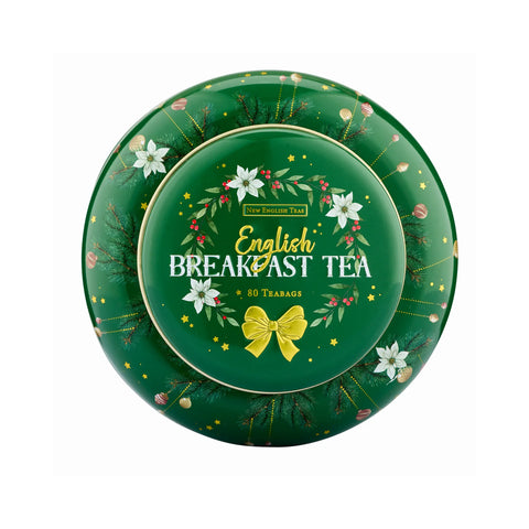 A round green tea tin with a festive wreath design, featuring the text 'English Breakfast Tea' and '80 TEABAGS' on a white background.