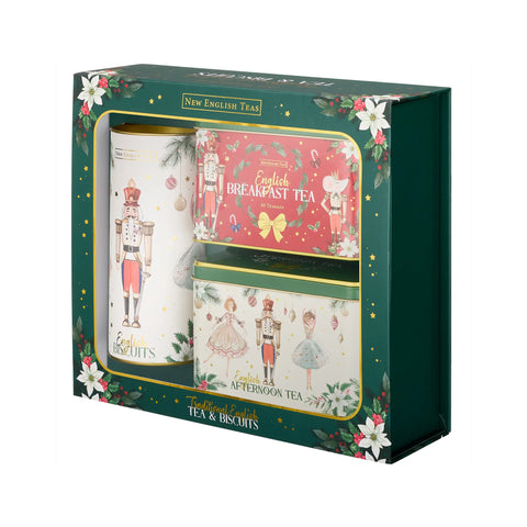 New English Tea's Christmas-themed tea and biscuits gift set in a dark green box with floral illustrations. The set includes a tin of English Breakfast Tea, a tin of Afternoon Tea, and a large box of biscuits decorated with nutcracker and ballerina illustrations.