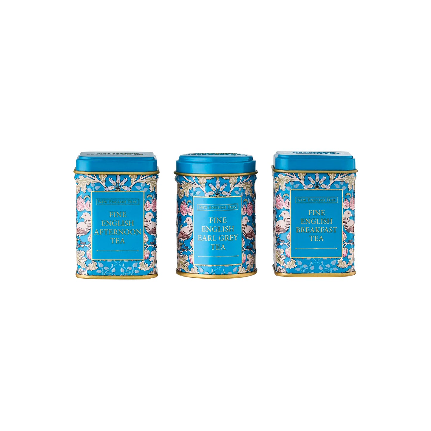 Three tea tins with decorative blue lids and floral designs on a white background