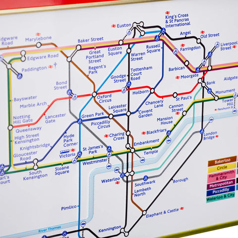 A close-up of a London Underground map showing multiple colored transit lines, station names, and a legend in the bottom right corner.