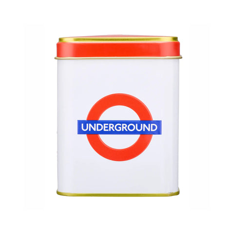 A square white metal tin with a red lid, featuring the red and blue London Underground roundel logo on the front.