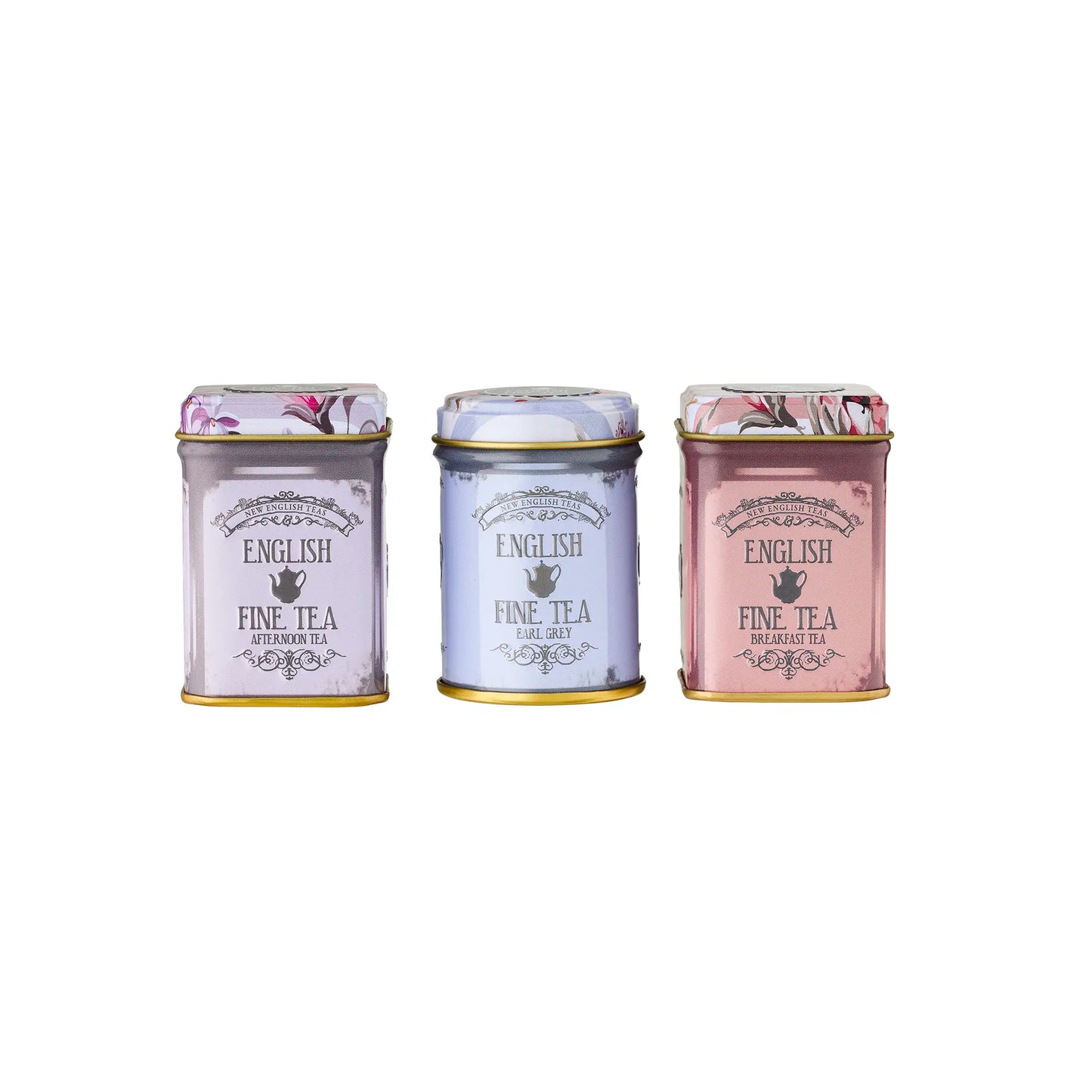 Three small tea tins with decorative labels on a white background
