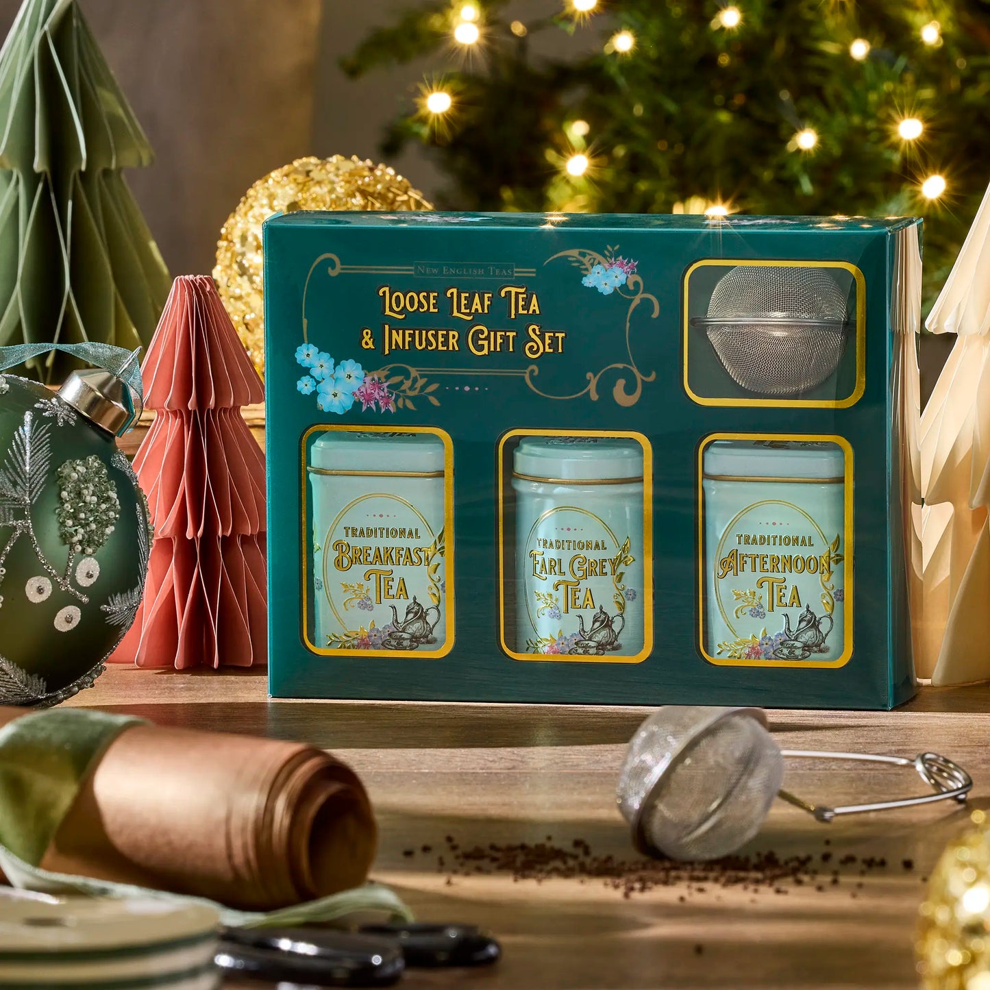 Vintage Victorian Loose leaf tea and infuser gift set with Christmas decorations in the background by New English Teas